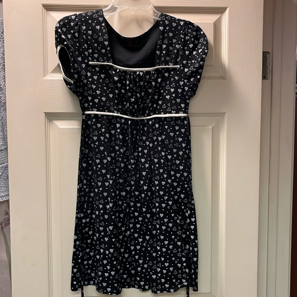 Feathers black dress with grey hearts silver piping around arm holes and chest